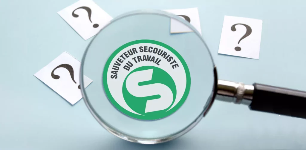 Une loupe grossi le logo SST vert et blanc pour répondre à la question La formation SST, c’est quoi ?